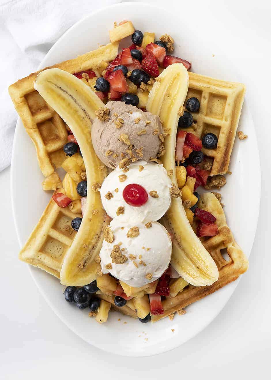 Overhead Image of Breakfast Banana Split with Waffles, Fresh Fruit, and "faux" ice cream
