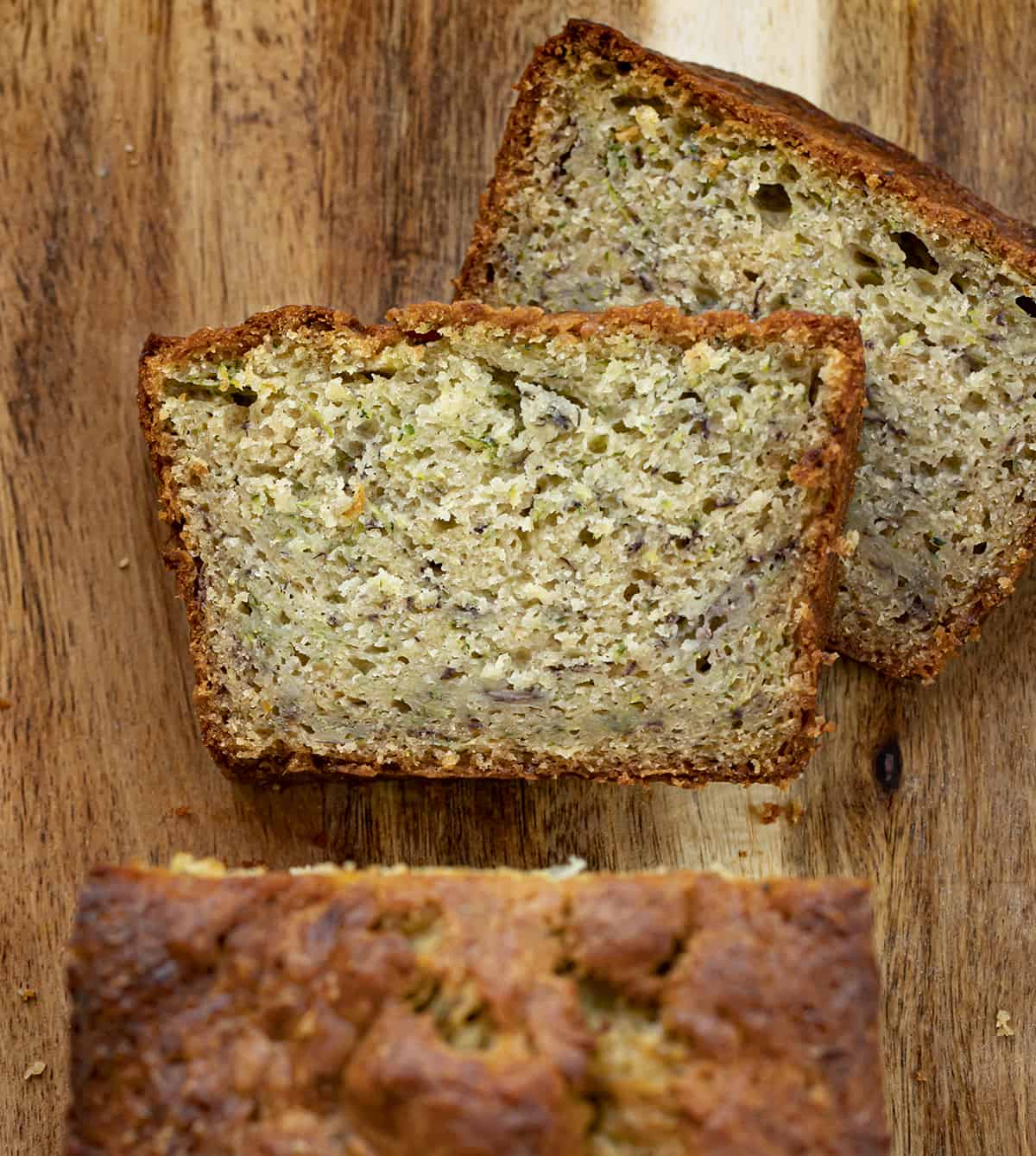 Pieces of Banana Zucchini Bread Cut and Laying Down Next to Loaf on Cutting Board. Quick Bread, Banana Bread, Zucchini Bread, Baking, Zucchini Recipes, How to Bake with Zucchini, Easy Bread Recipe, Easy Zucchini Bread, Dessert, Snack, i am baker, iambaker