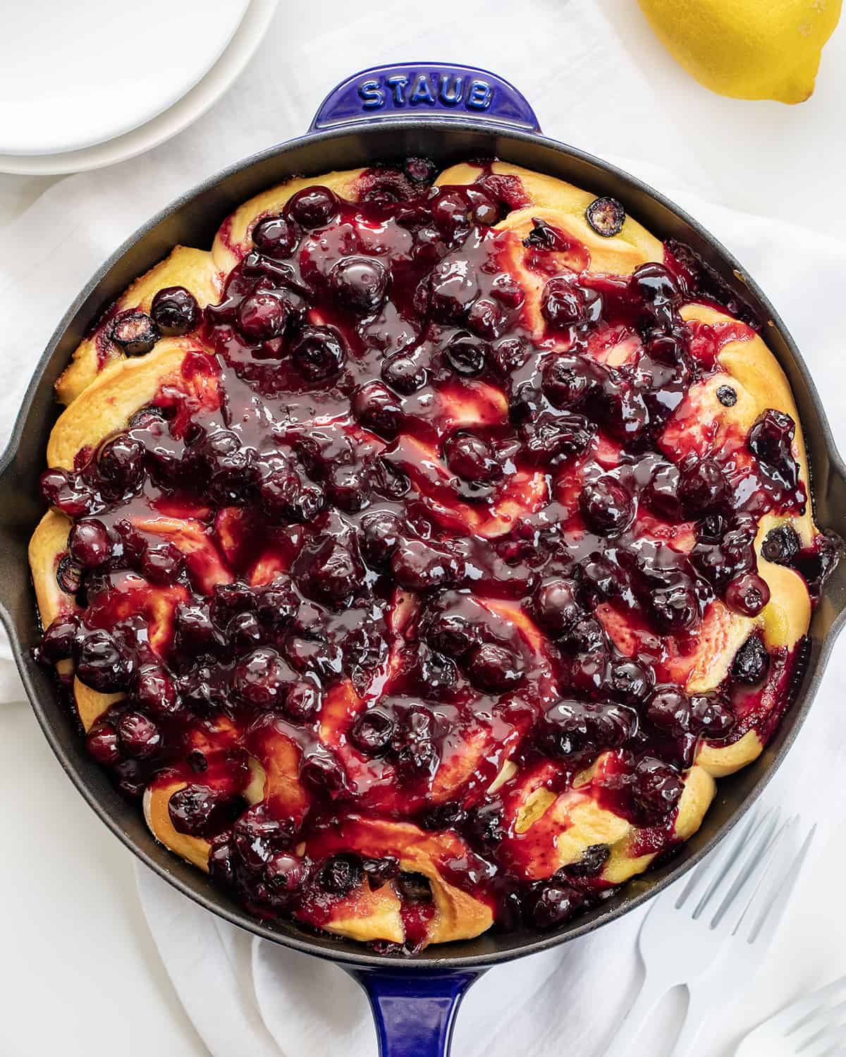 Blueberry Lemon Skillet Rolls in Skillet on a White Counter. 