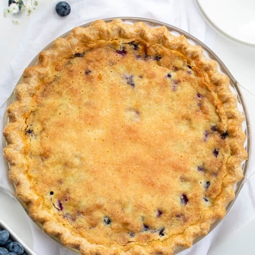 Overhead of a Baked Blueberry Buttermilk Pie. Dessert, Baking, Pie, Pie Crust, Best Pie Crust, Buttermilk Pie, Blueberry Pie, Christmas Dessert, Summer Dessert, Old Fashioned Dessert, i am baker, iambaker