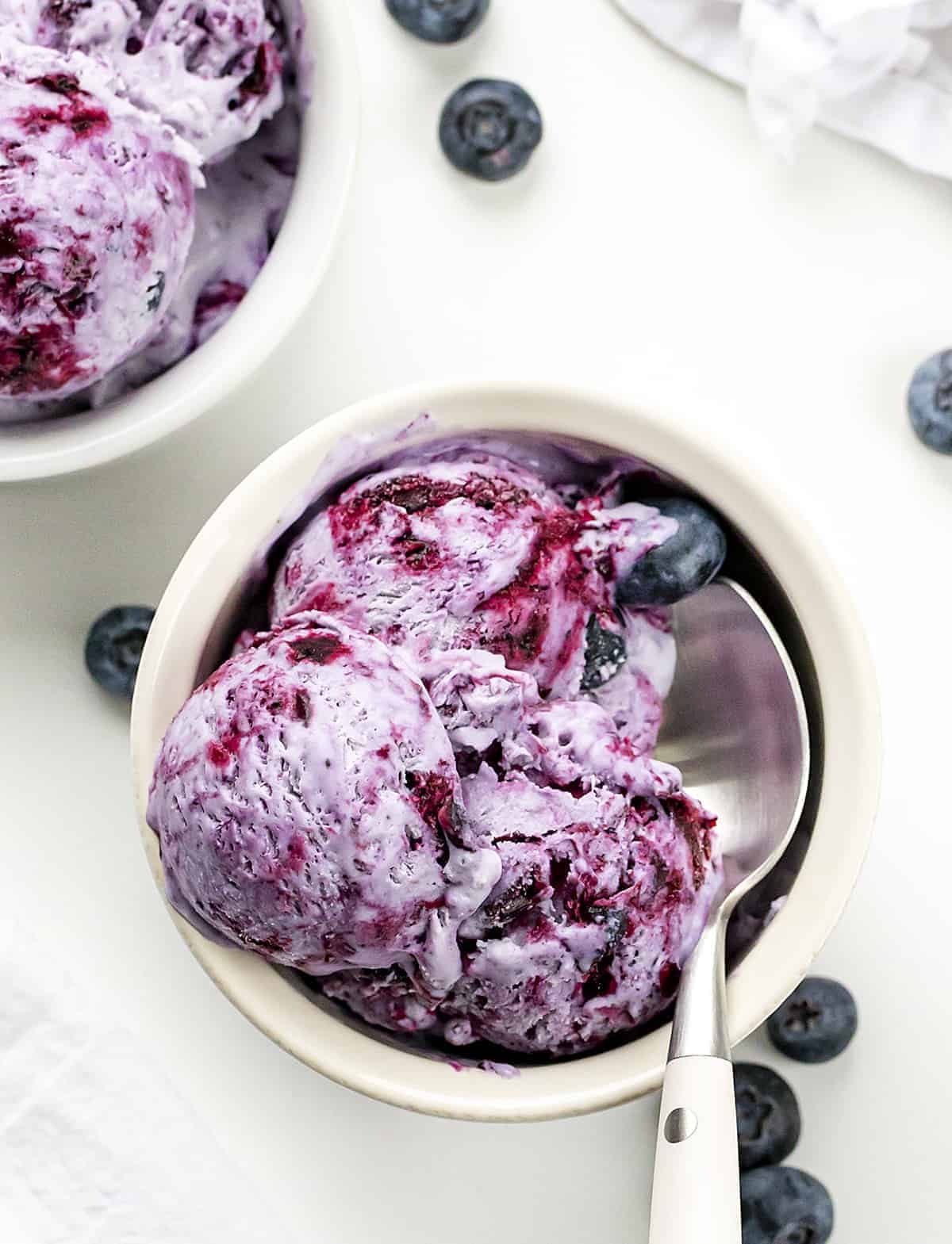 Two Bowls of Blueberry No-Churn Ice Cream with Spoon from Overhead. 