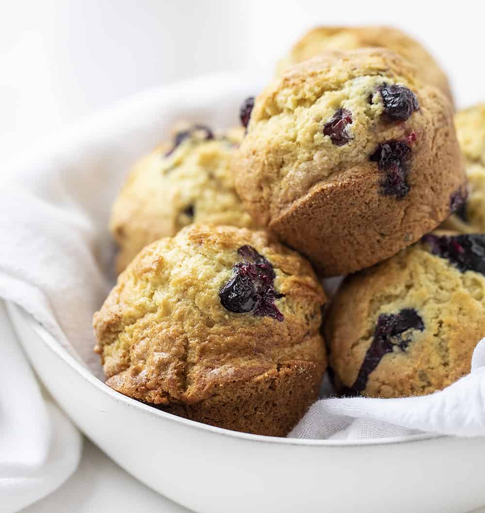 Bowl with a White Towel and Sourdough Blueberry Muffins Inside