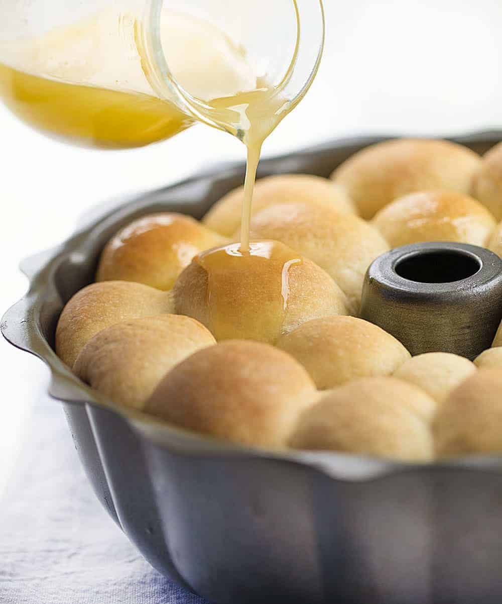 Pouring Butter over Bubble Bread in Bundt Pan