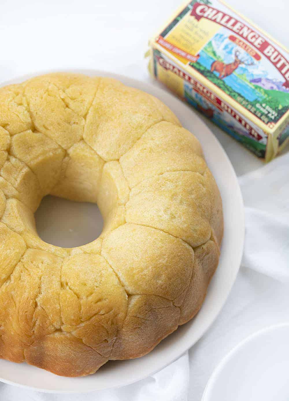 Overhead view of Bubble Bread on a White Plate with Butter