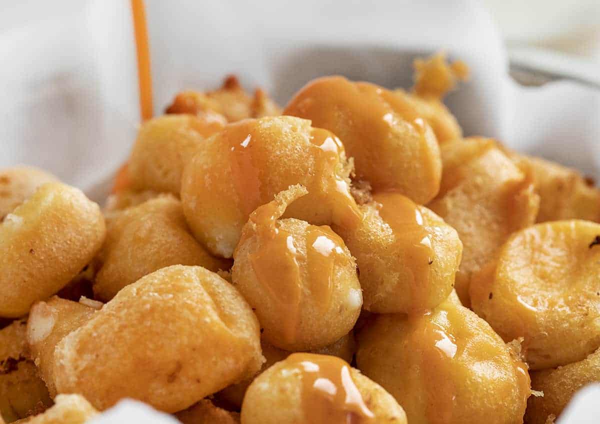 Drizzling Buffalo Sauce over Buffalo Cheese Curds