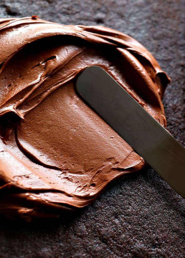 Smoothing Frosting on Chocolate Cake