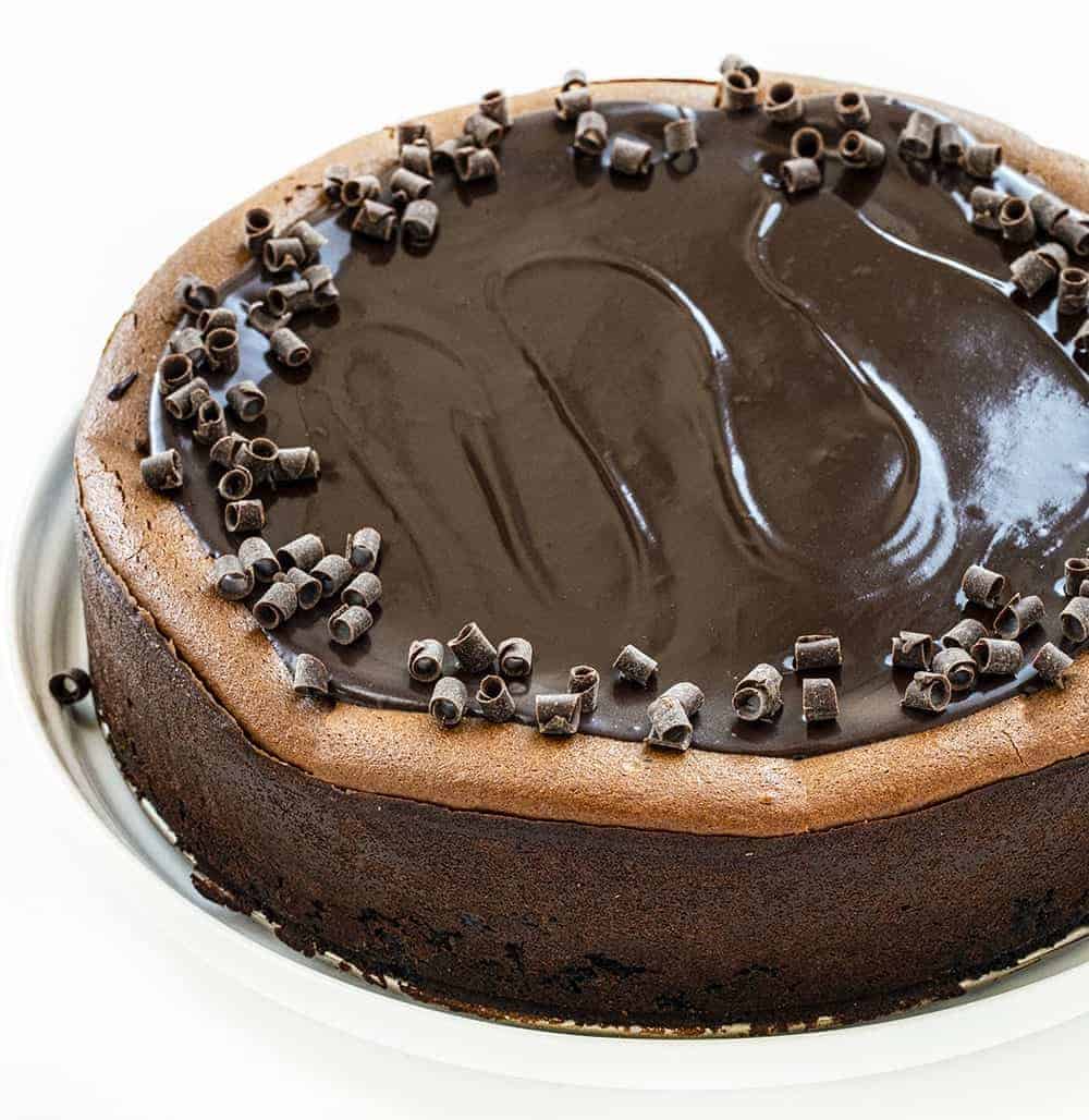 Triple Chocolate Cheesecake from Overhead Showing the Shiny Top and Chocolate Curls