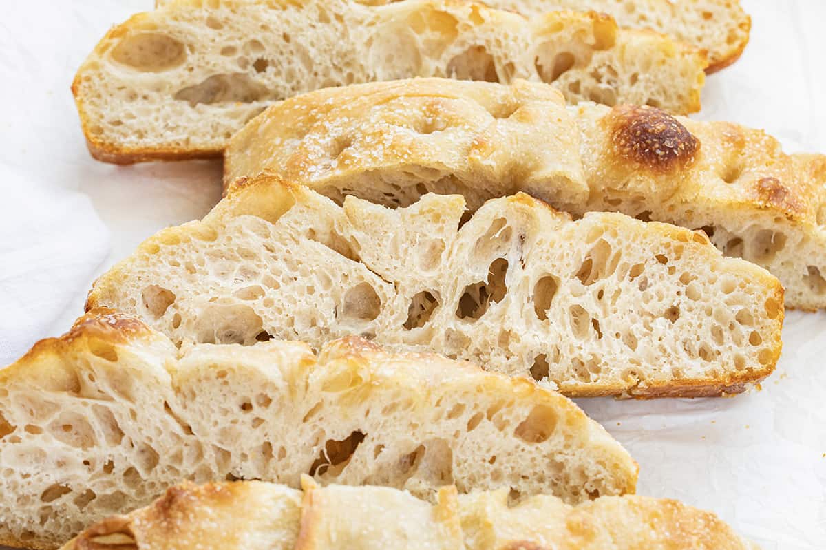 Close up of Sourdough Focaccia After it Has Been Cut Into Pieces.