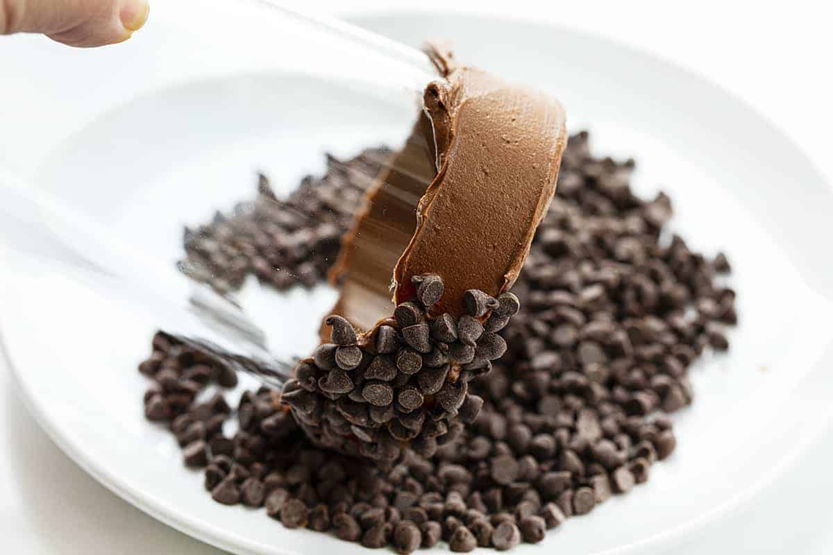 Dipping a Glass that has the rim covered in Chocolate in Mini Chocolate Chips