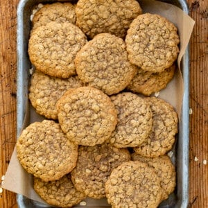 Pan of Real Oatmeal Cookies on a Wooden Cutting Board.