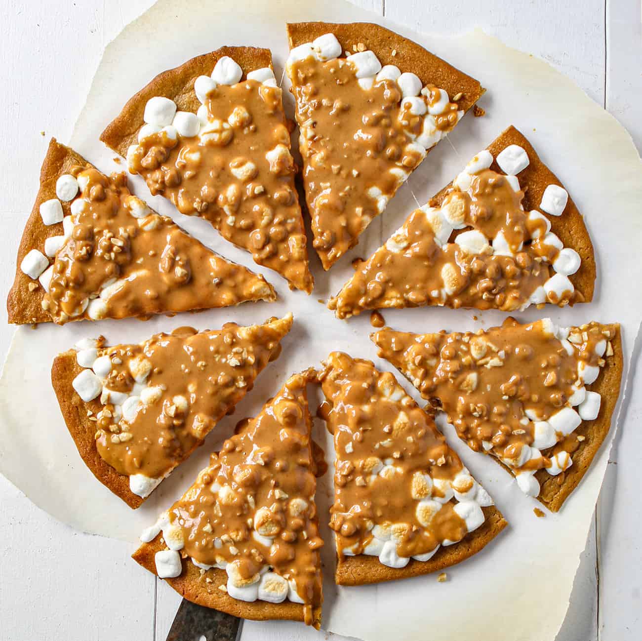 Peanut Butter Marshmallow Dessert Pizza Cut Into Slices and Shot from Overhead Looking Down 