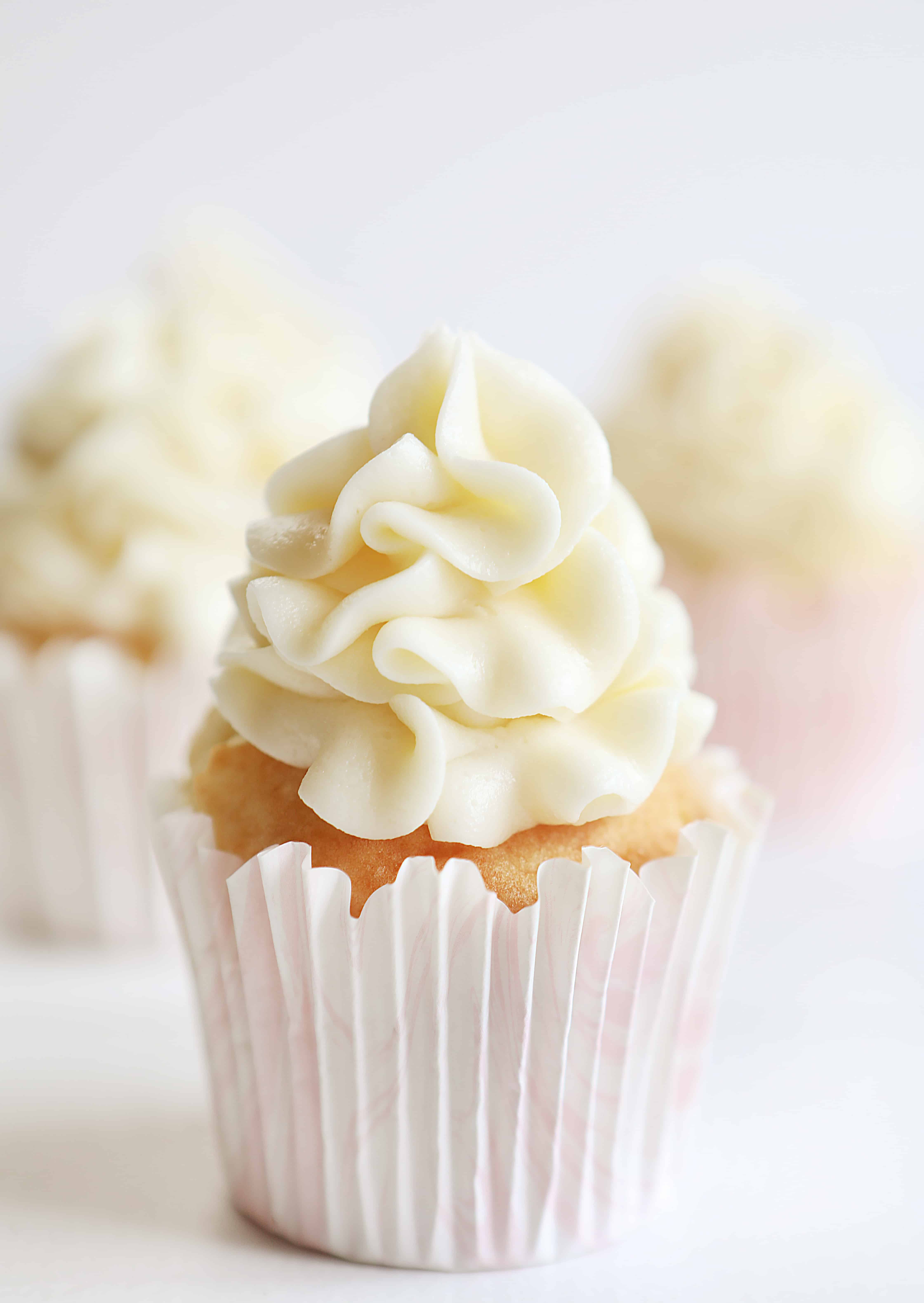 Vanilla Cupcakes with Raspberry Filling and Cream Cheese Frosting