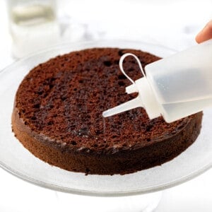 Pouring Simple Syrup Over Cake.