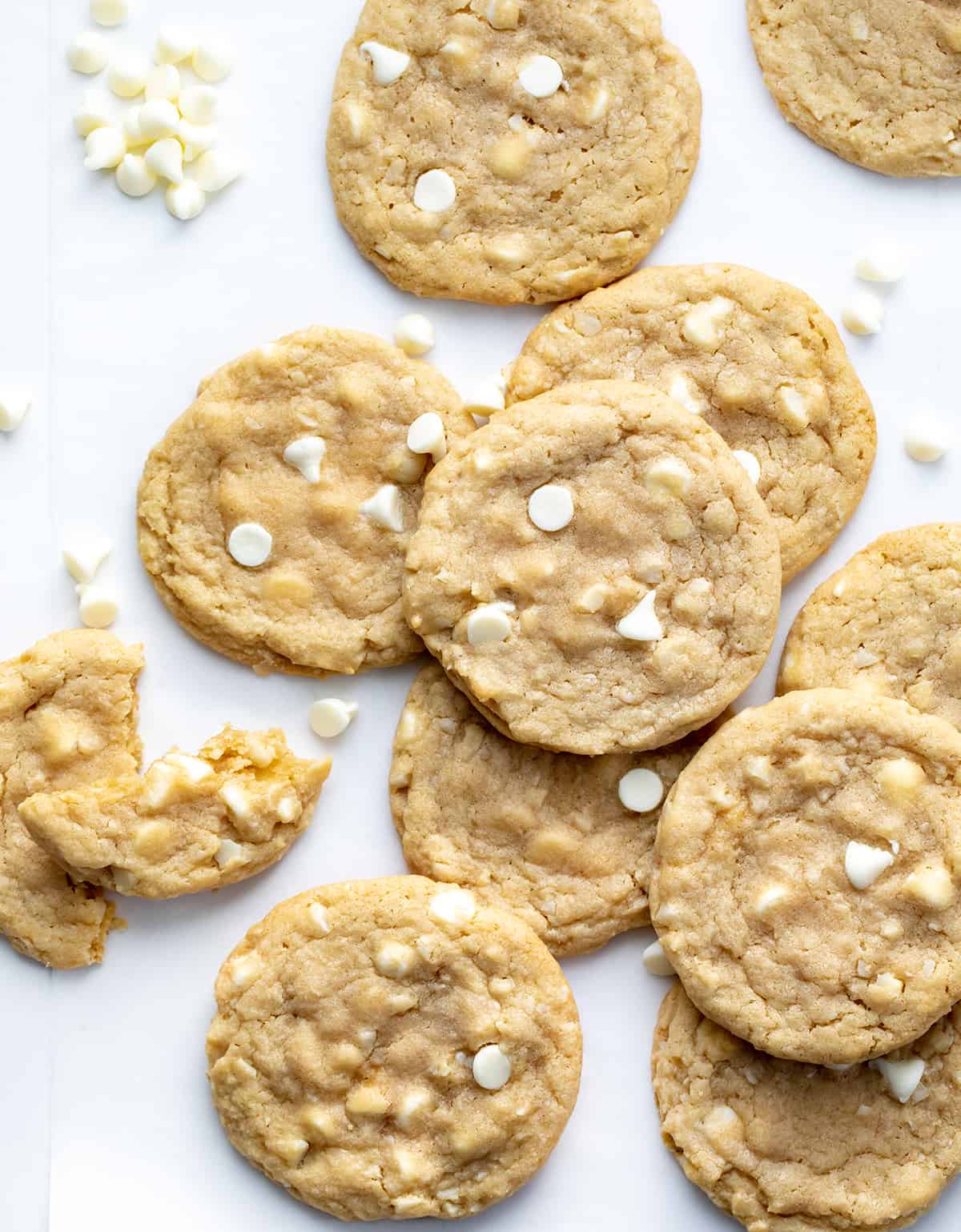 White Chocolate Macadamia Nut Cookies with White Chocolate Chips and a Broken in Half Cookie.